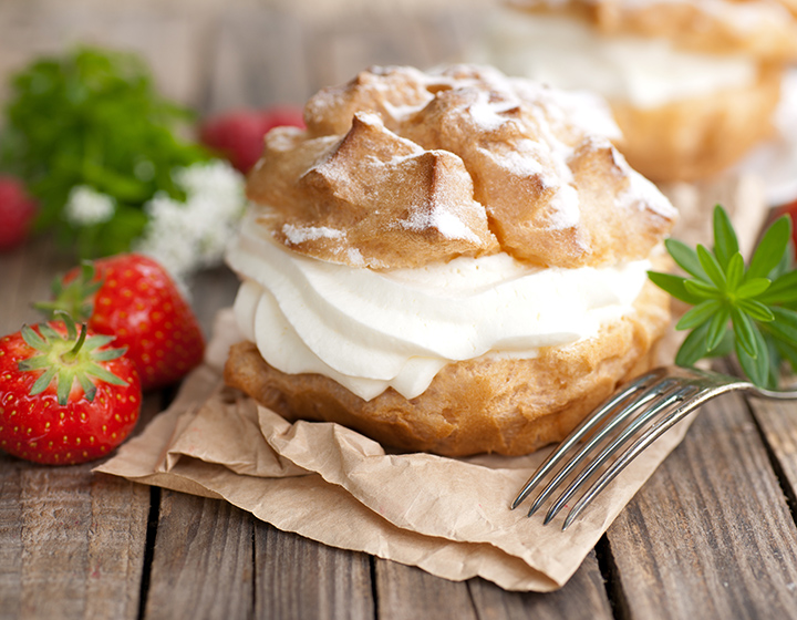 Cream filled pastry with strawberries and fork