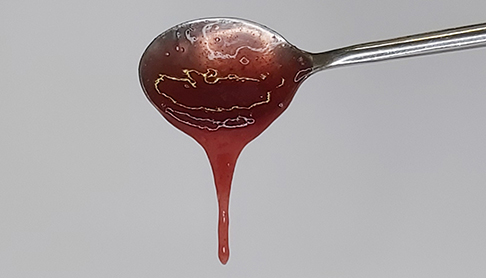 NOVATION 9460 red jam dripping freely from a spoon