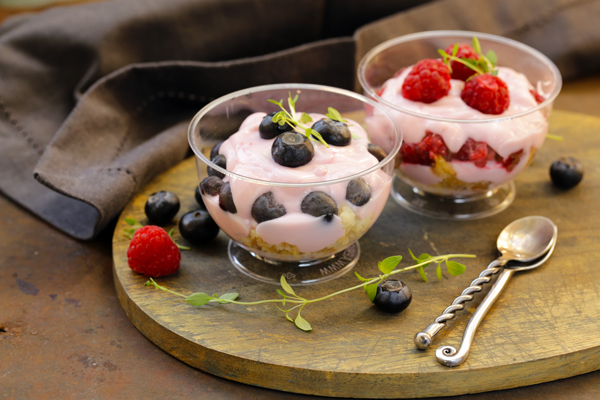 dessert with berries and yogurt in a glass