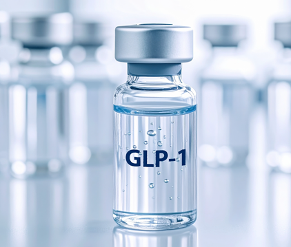 GLP-1 medication vial with clear liquid, surrounded by similar vials on a reflective surface.