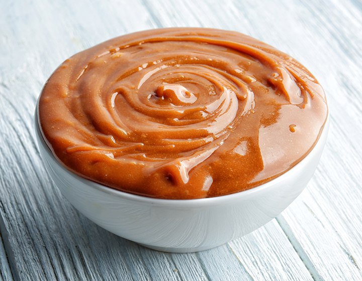Caramel sauce in a white bowl