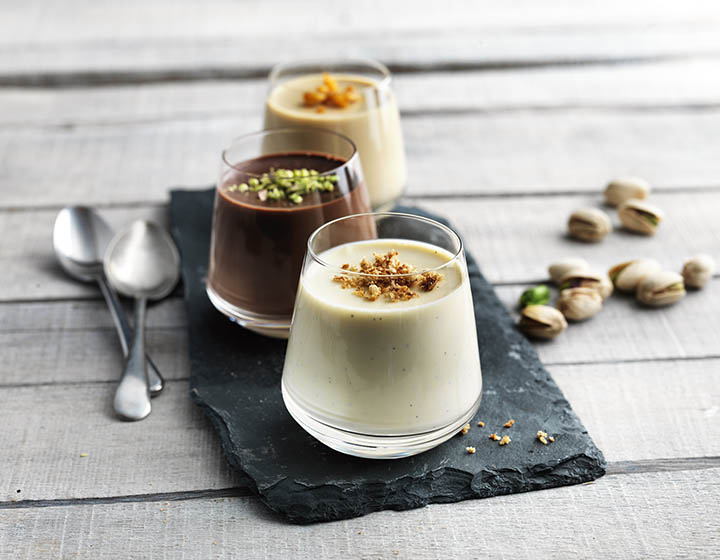 Trio of white, cream and brown cream desserts