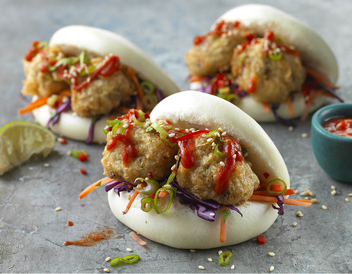 White Boa buns stuffed with pickles, chillies and red sauce