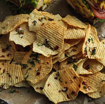 Crisps, topped with chillies and herbs