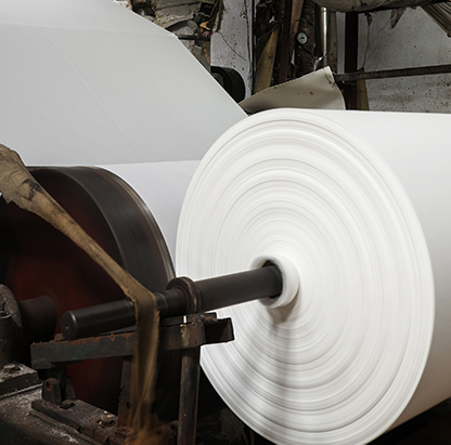 Paper towel being manufactured in a factory