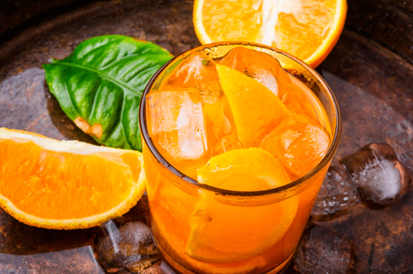 Fresh cocktail with orange and ice.Fresh fruit lemonade drinks