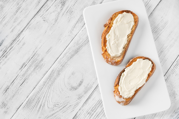 Toasts with cream cheese on the serving plate