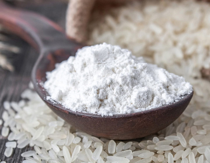 Clean label powdered ingredient in spoon over rice