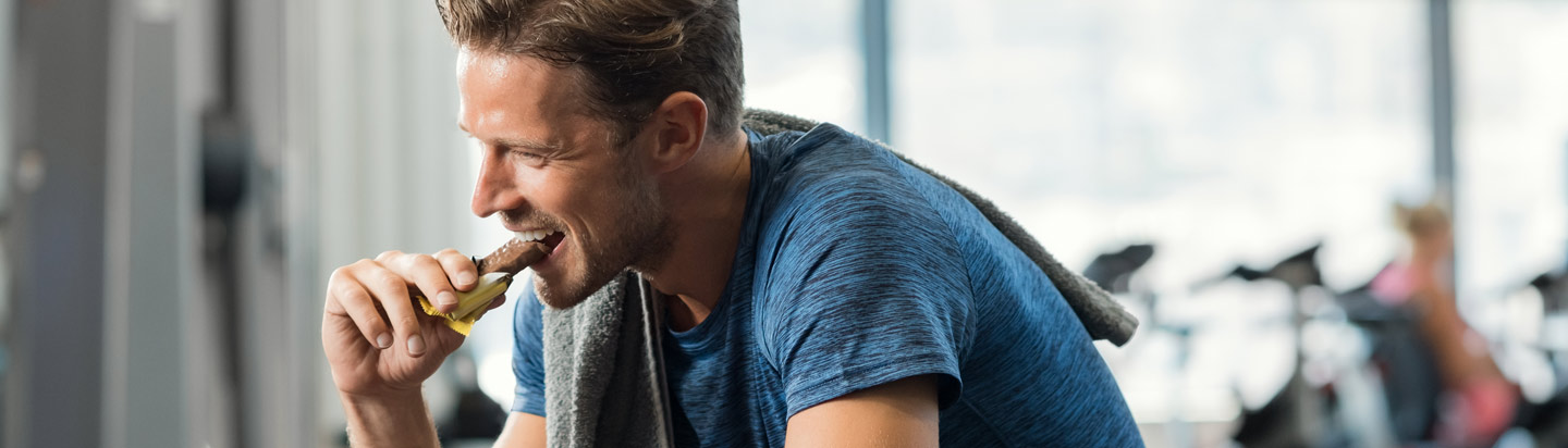 Man eating nutritious snack bar