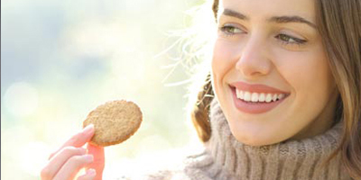 Woman with protein-enriched cookie