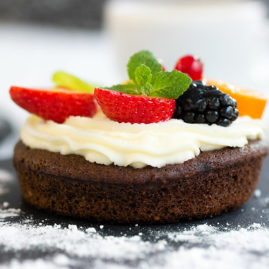 Small chocolate cake with berries