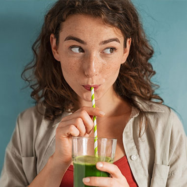 Woman drinking a vegetable smoothie