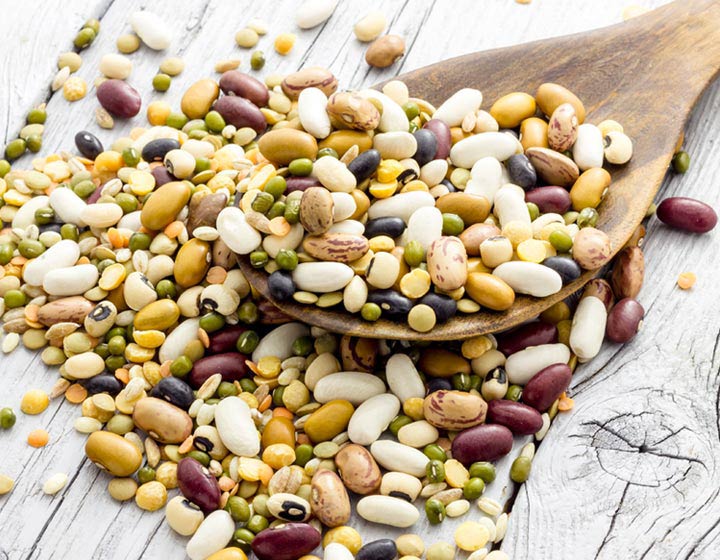 Pulses and a spoon on a table