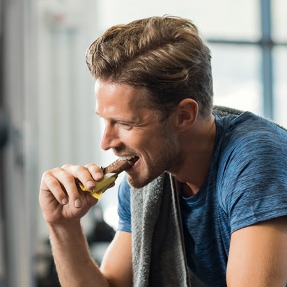 Man eating nutritious snack bar